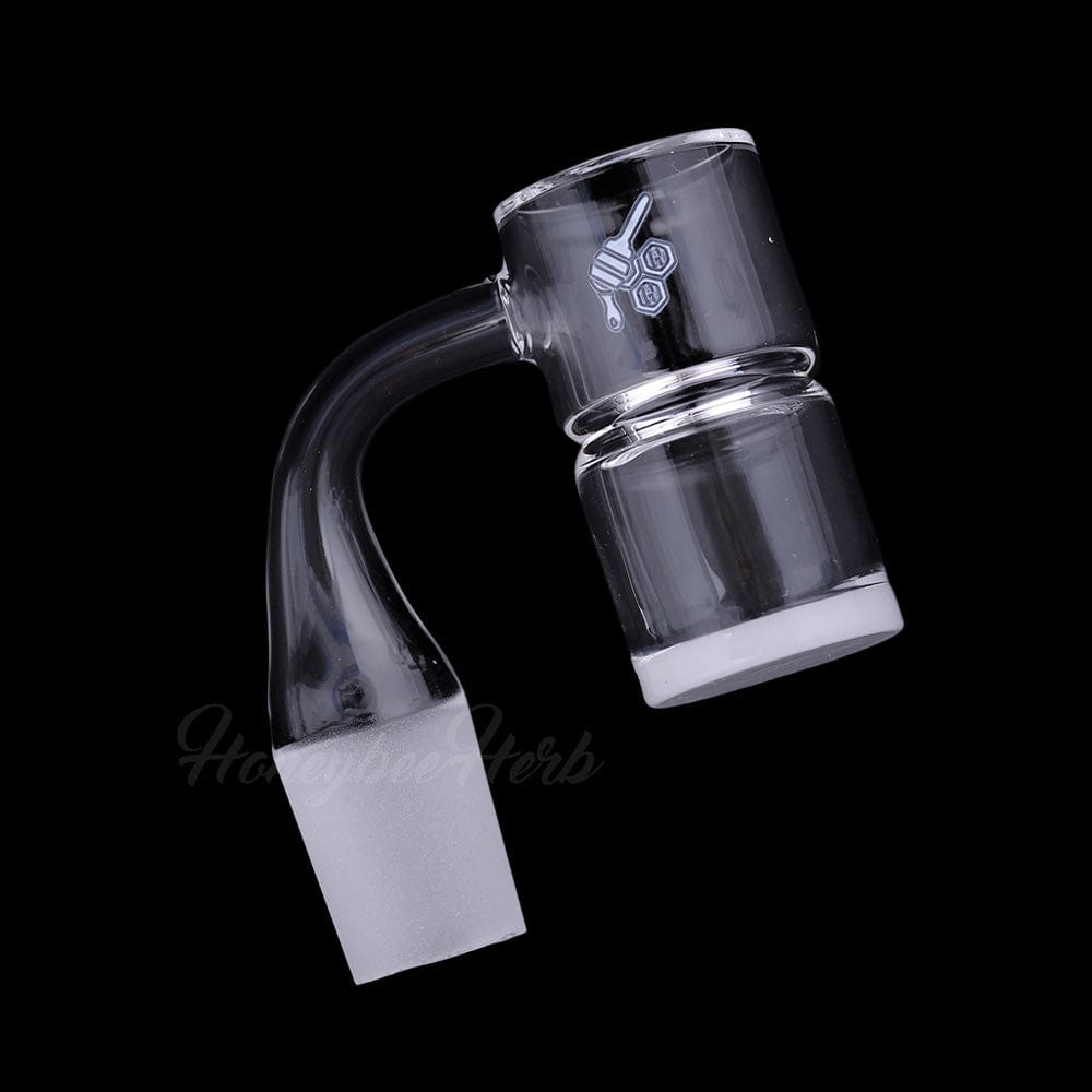 Angled close-up of the HONEY & MILK BEVEL SPLASH BUCKET QUARTZ BANGER - 90Â° DEGREE | YL showing its clear bent neck, thick bucket and frosted ground joint against a black background