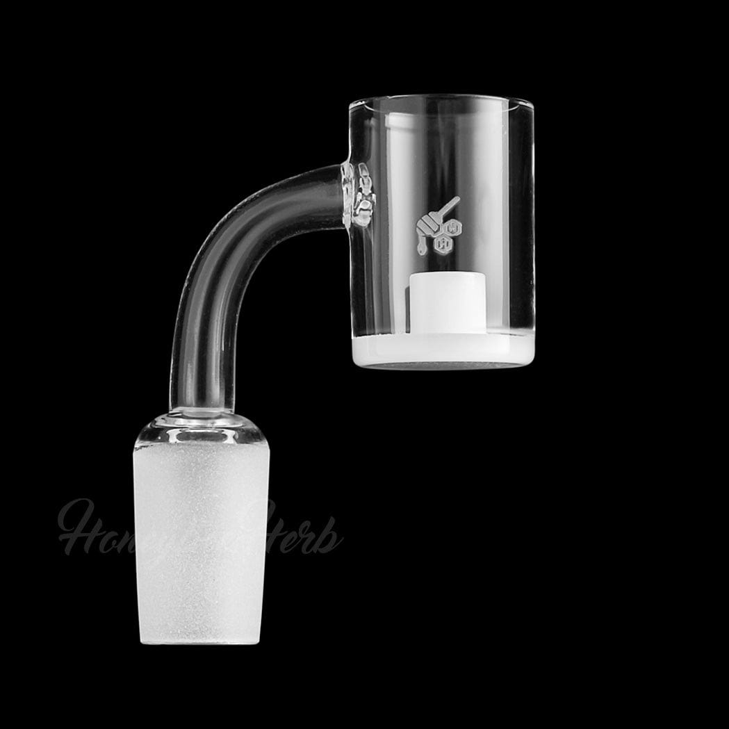 A close-up, angled view of the HONEY & MILK CORE REACTOR QUARTZ BANGER, featuring a 90-degree design and clear quartz construction.