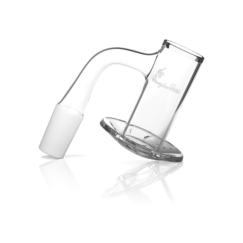 Angled close-up of the Honeybee Herb Beehive Quartz Banger - 90Â° Degree | Bl showing its clear glass bucket, curved 90° neck, and subtle logo on a white reflective background