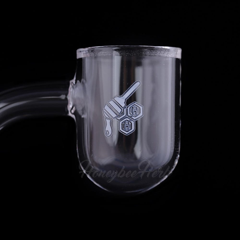 Close-up front view of the Honey Bevel Bowl Quartz Banger - 45° Degree | Yl showing its clear rounded chamber and honeycomb logo.
