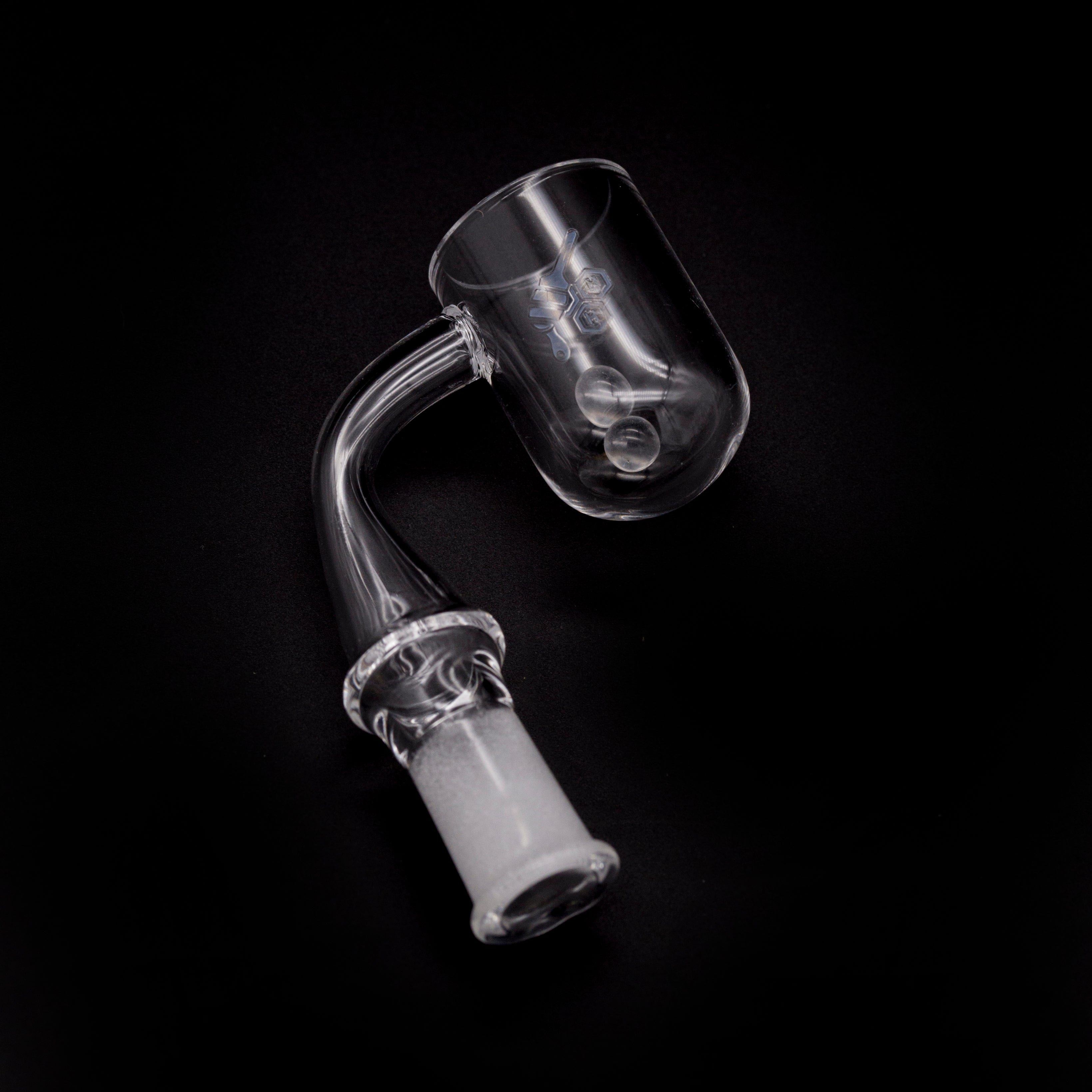 A side view of the HONEY CYCLONE QUARTZ BANGER - 90° DEGREE, showing the clear quartz banger angled against a dark backdrop.