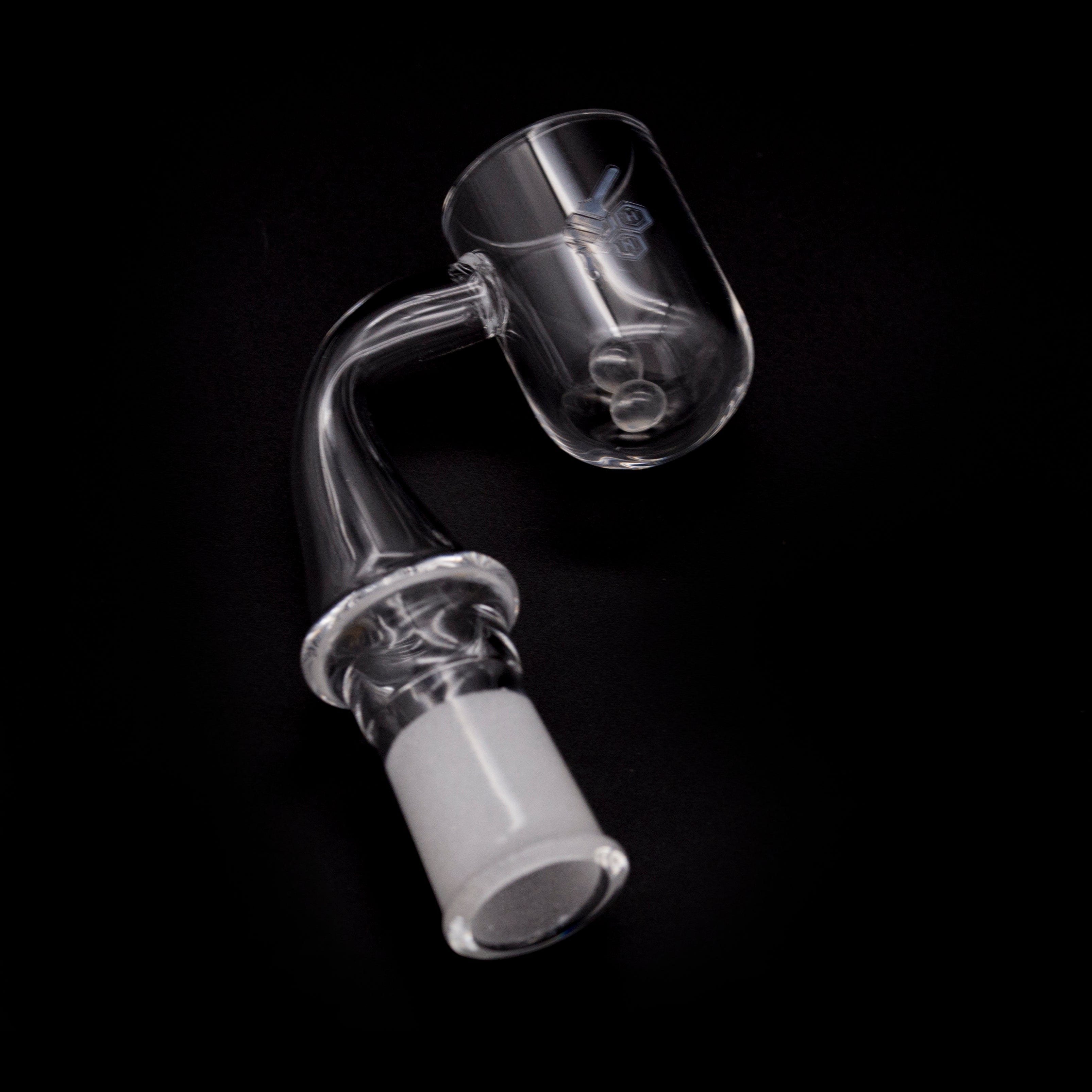 A close-up, angled view of the HONEY CYCLONE QUARTZ BANGER - 90° DEGREE, showcasing its clear quartz construction and unique 90-degree bend.