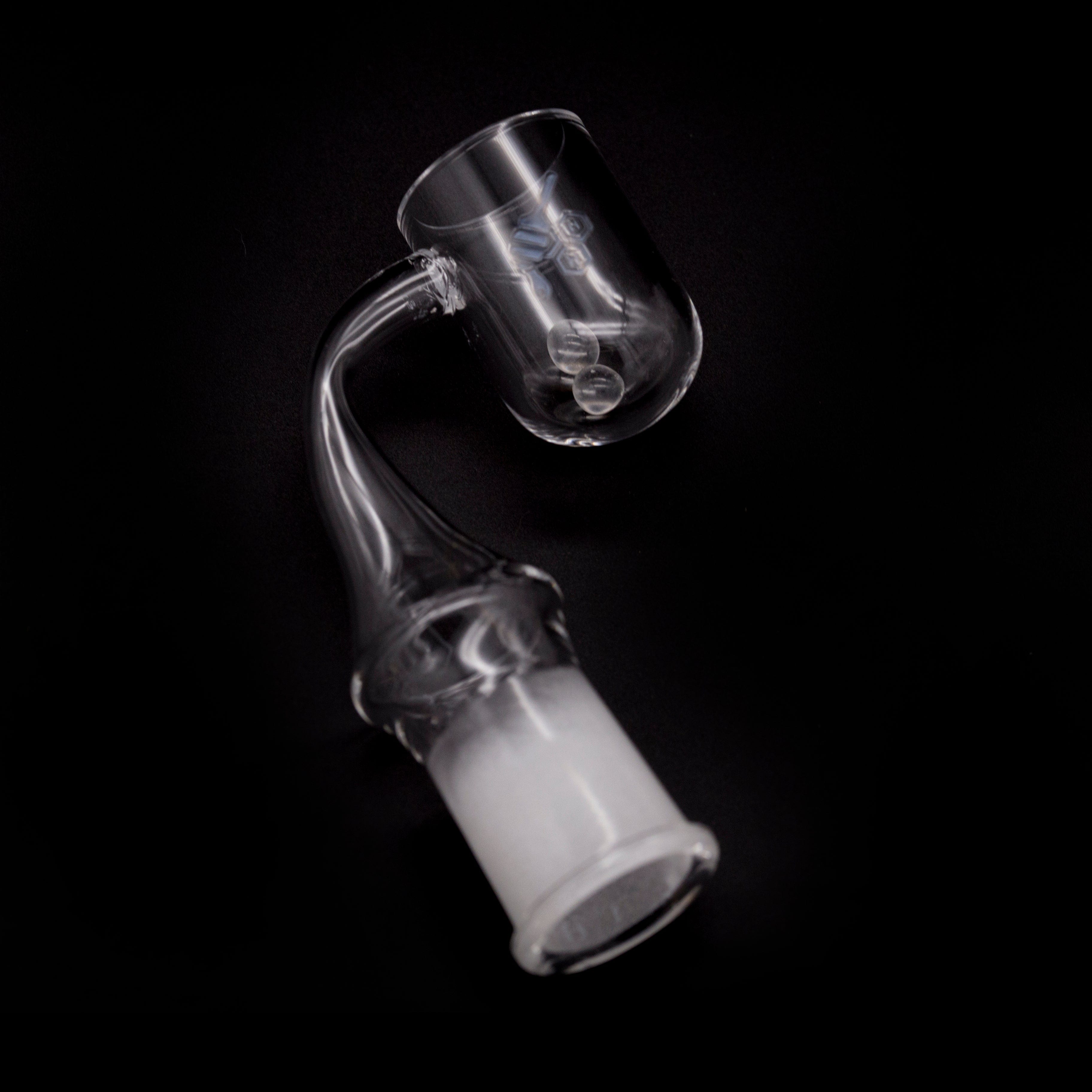 A tilted, close-up view of the HONEY CYCLONE QUARTZ BANGER - 90° DEGREE, showing its clear quartz construction and angled design.