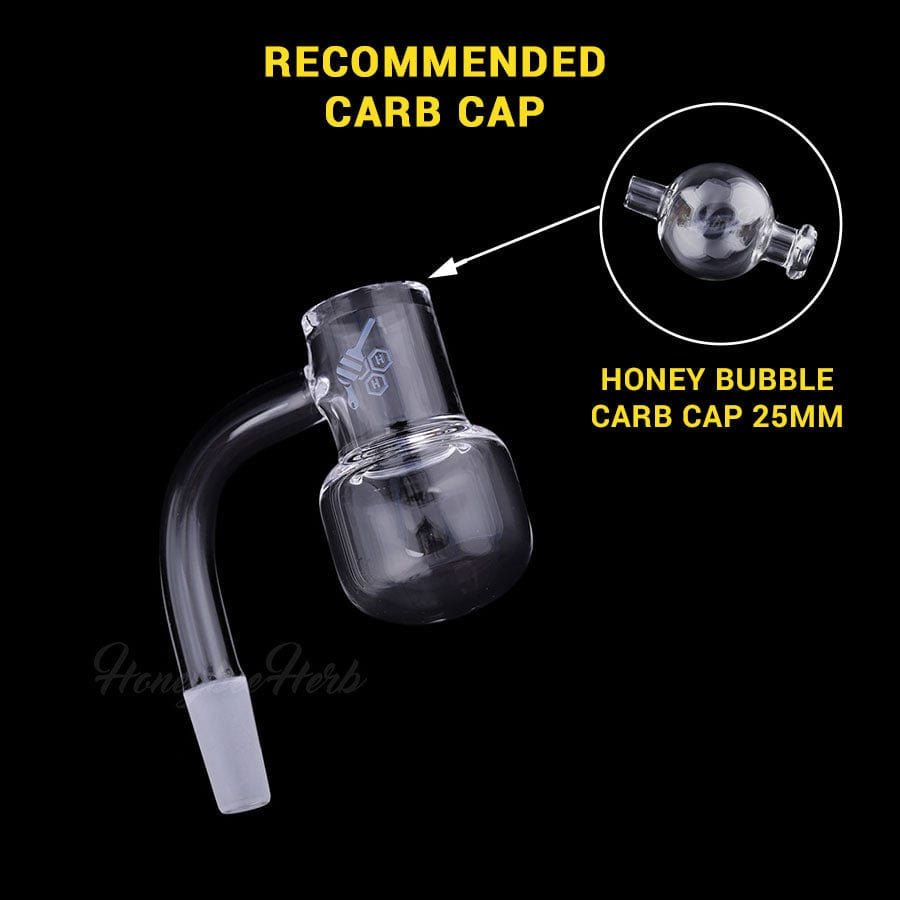 Close-up three-quarter view of the Honey Kettle Quartz Banger - 90Â° Degree | Yl showing its clear glass bucket and curved joint against a black background.