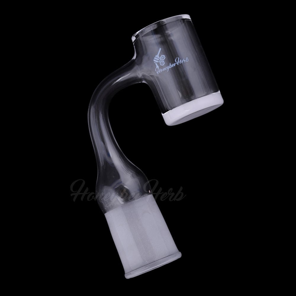 Angled close-up of the Honey & Milk Bevel Quartz Banger- 90Â° Degree | Bl showing its curved 90-degree joint and white-tipped quartz cup against a black background