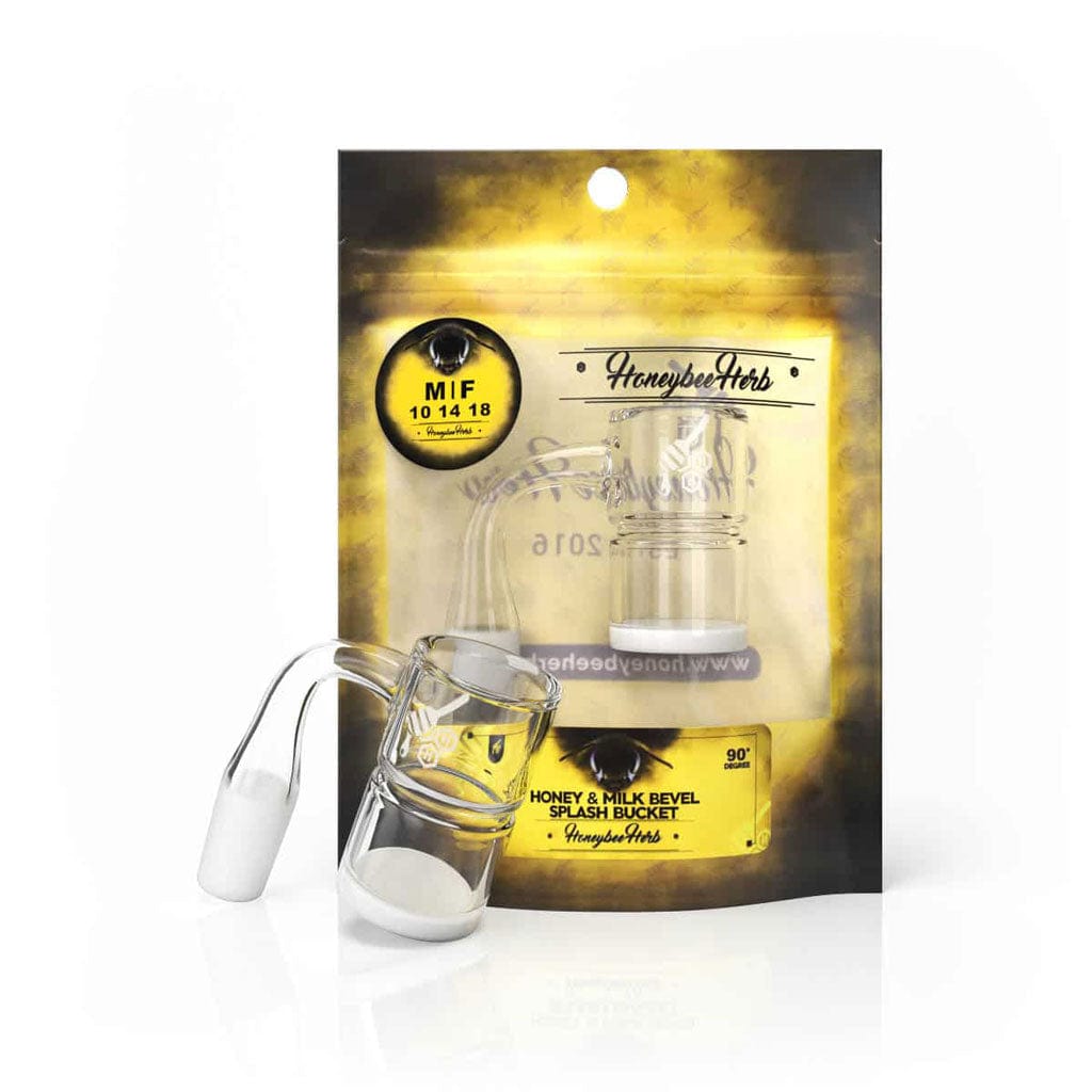 Front three-quarter view of the HONEY & MILK BEVEL SPLASH BUCKET QUARTZ BANGER - 90Â° DEGREE | YL resting against its yellow and black branded pouch on a white reflective surface.