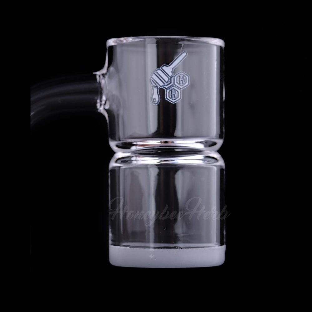 Center-close view of the HONEY & MILK BEVEL SPLASH BUCKET QUARTZ BANGER - 90Â° DEGREE | YL showing its clear glass cup and thick frosted base against a black background.