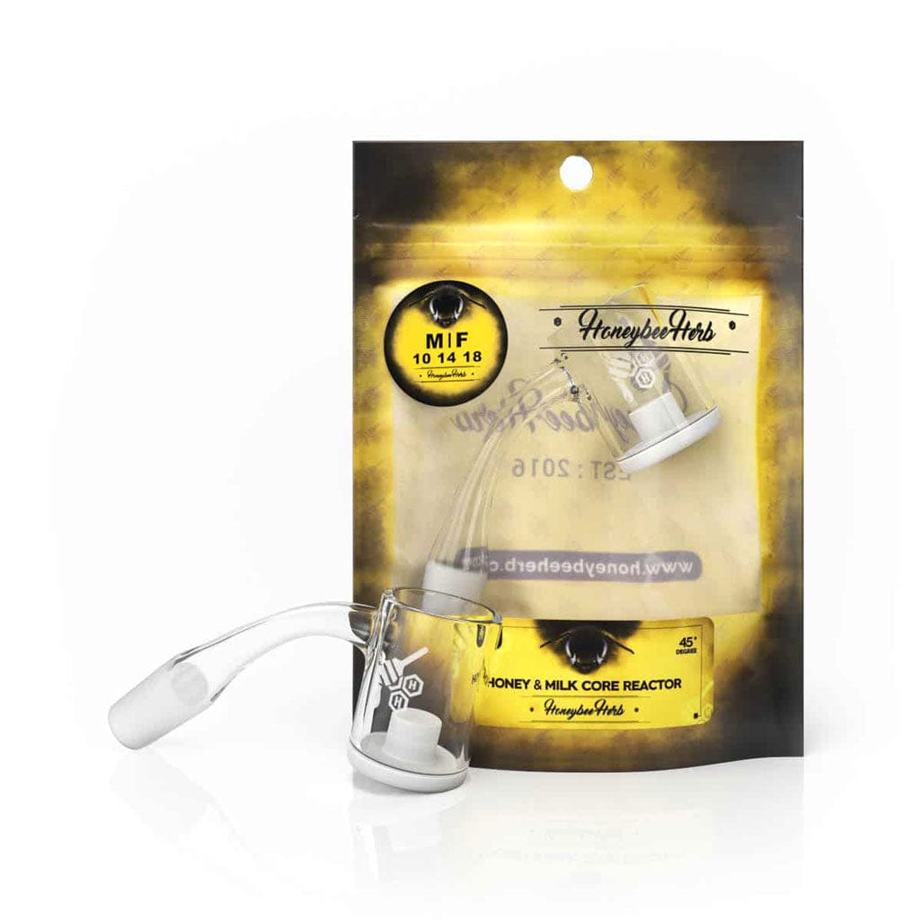 Angled close-up of the HONEY & MILK CORE REACTOR QUARTZ BANGER - 45Â° DEGREE | YL resting in front of its yellow branded pouch, shown on a white reflective surface.