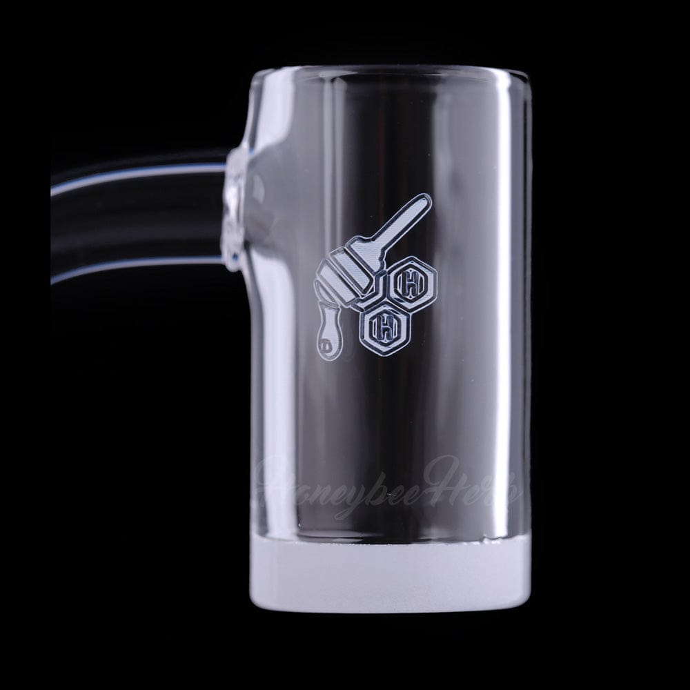 Close-up front view of the HONEY & MILK ENAIL QUARTZ BANGER - 90Â° DEGREE | YL showing its clear glass chamber with a honey-dipper logo and angled joint against a black background