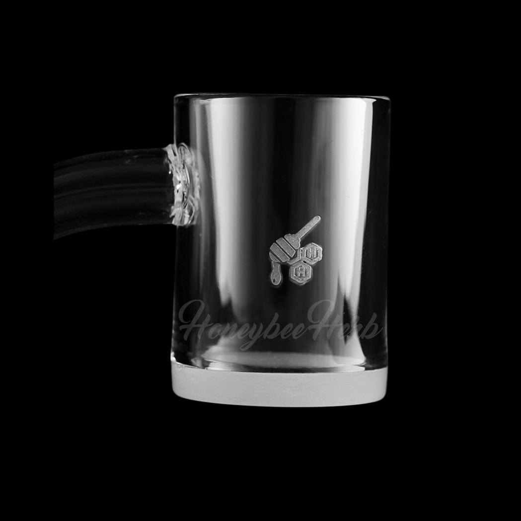 A 45-degree angled view of the HONEY & MILK QUARTZ BANGER, showing the clear glass banger against a dark background.