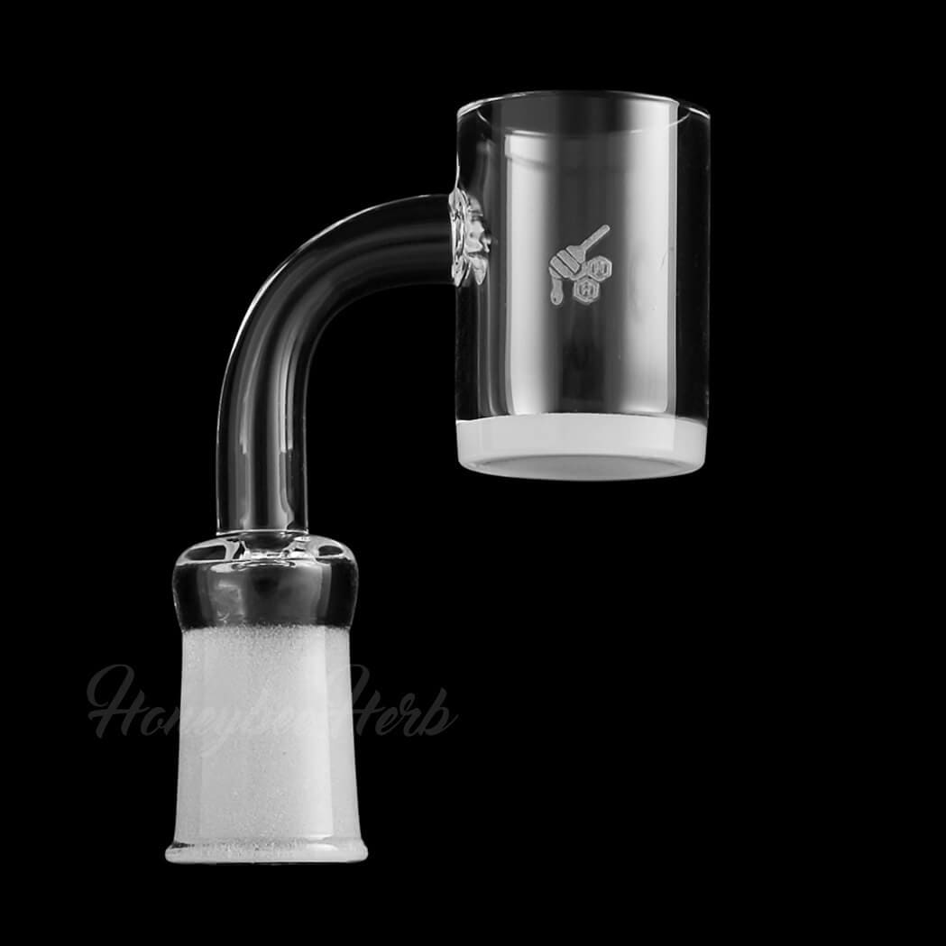 A close-up, angled view of the Honey & Milk Quartz Banger - 90° Degree, showing its clear quartz construction and rounded shape.