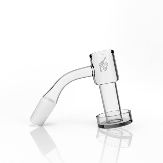 A 45-degree angled view of the HONEYSUCKLE BEVEL QUARTZ BANGER, reflecting off a polished surface.
