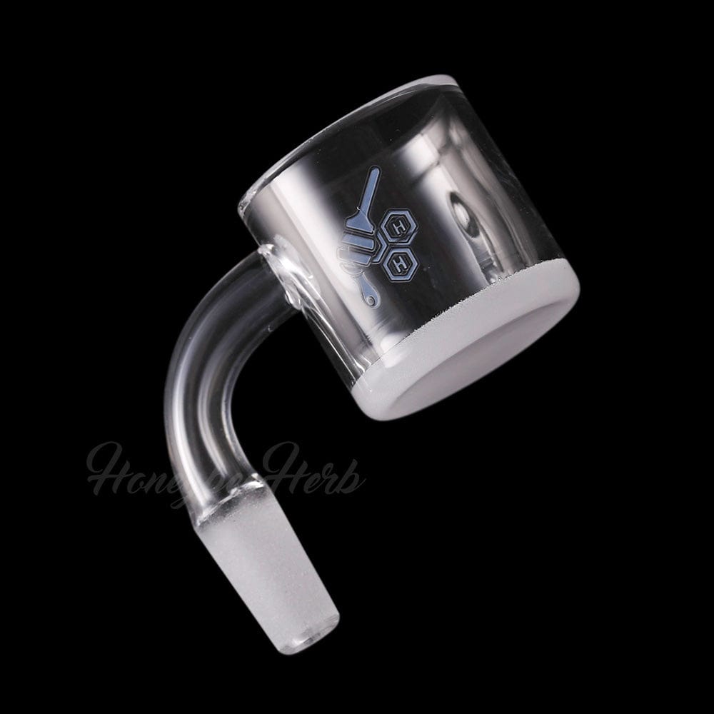 Angled close-up of the HONEY & MILK XL BEVEL QUARTZ BANGER - 90Â° DEGREE | YL showing its clear 90-degree neck, frosted joint, and beveled quartz cup against a black background