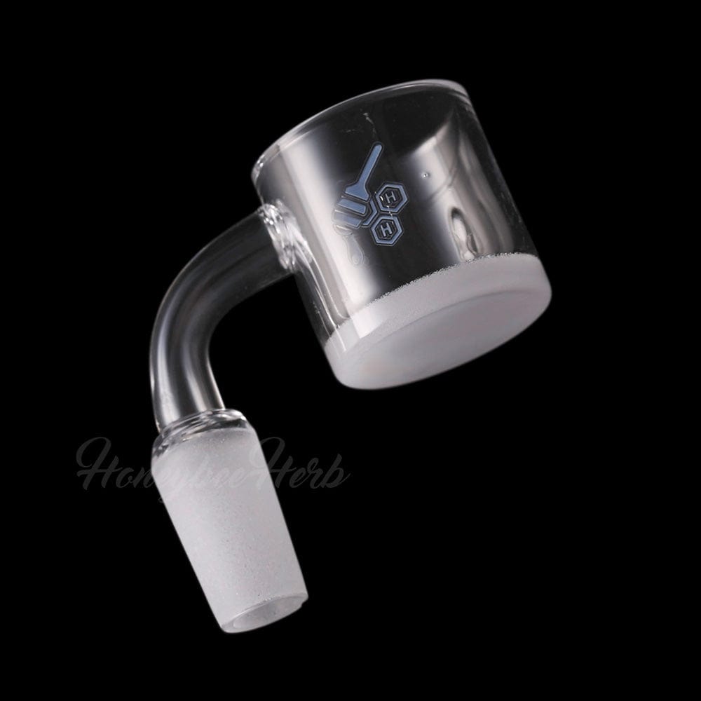 Angled close-up of the HONEY & MILK XL BEVEL QUARTZ BANGER - 90Â° DEGREE | YL showing its frosted joint and clear, cylindrical bucket against a black background
