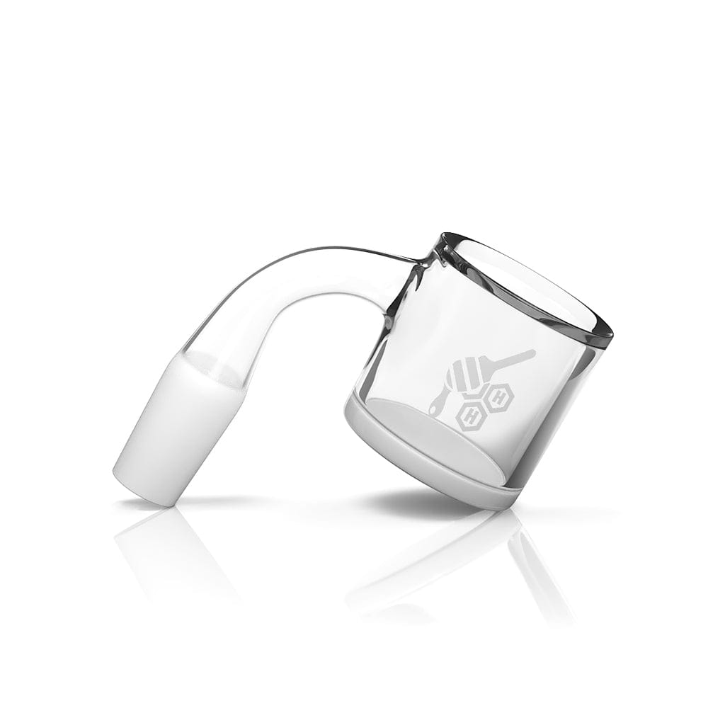 Angled studio close-up of the HONEY & MILK XL BEVEL QUARTZ BANGER - 90Â° DEGREE | YL showing its clear 90-degree elbow and beveled quartz bucket with subtle logo reflection.