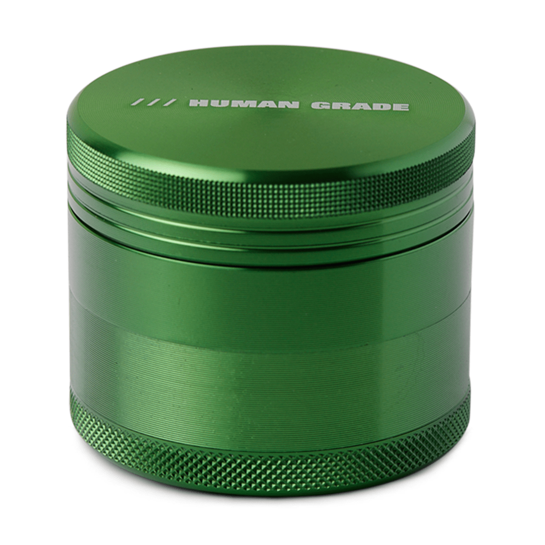 Front view of the Human Grade Grinder 1A (2"), a silver, four-piece grinder with a textured surface.