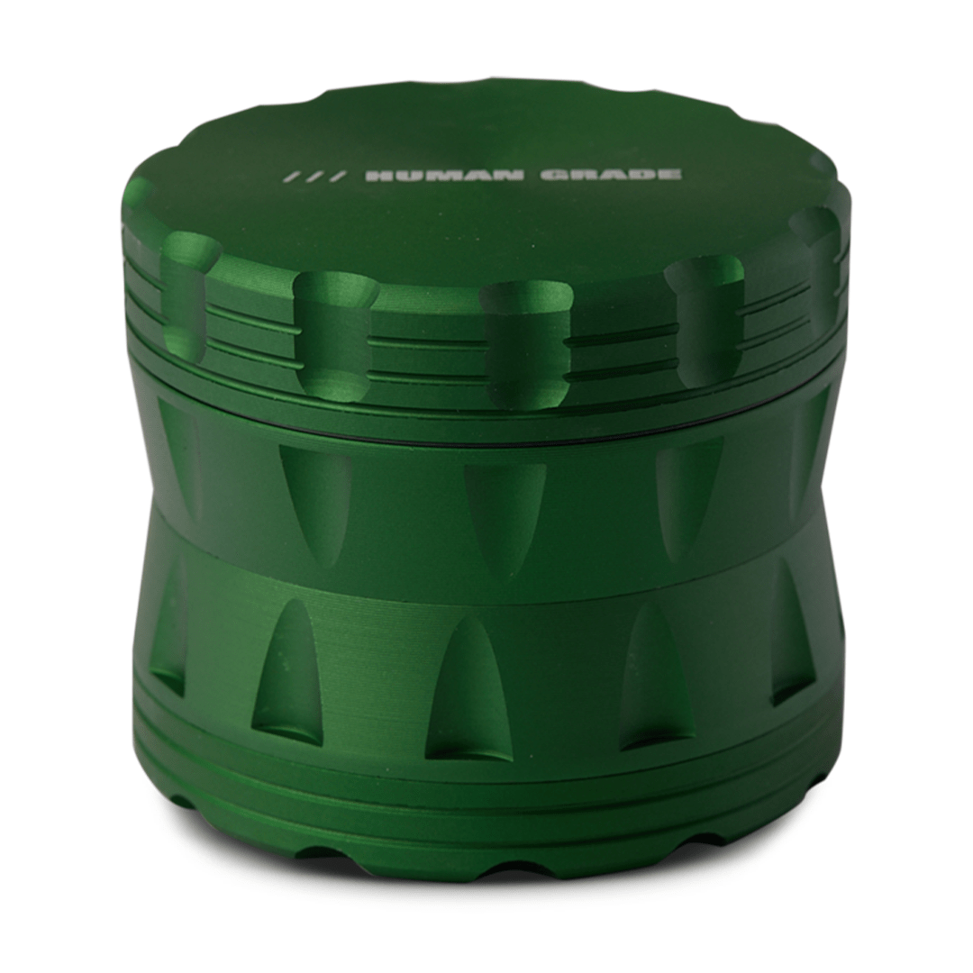 Front view of the Human Grade Grinder 2A (2.5” 4-Piece) featuring a dark green, textured metal exterior.