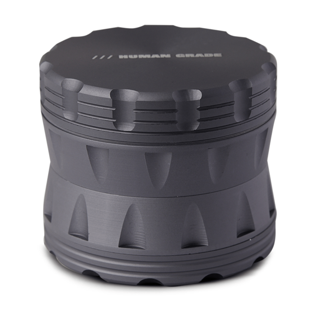 Front view of the Human Grade Grinder 2A (2.5" 4-Piece) with a textured, dark gray metallic finish.