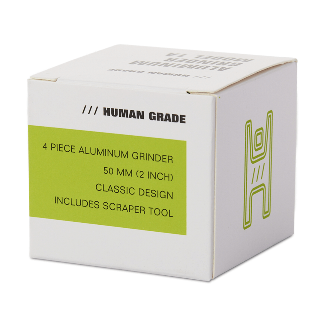 Front view of the Human Grade Grinder 1A (2” 4-Piece) with a metallic finish against a plain white background.