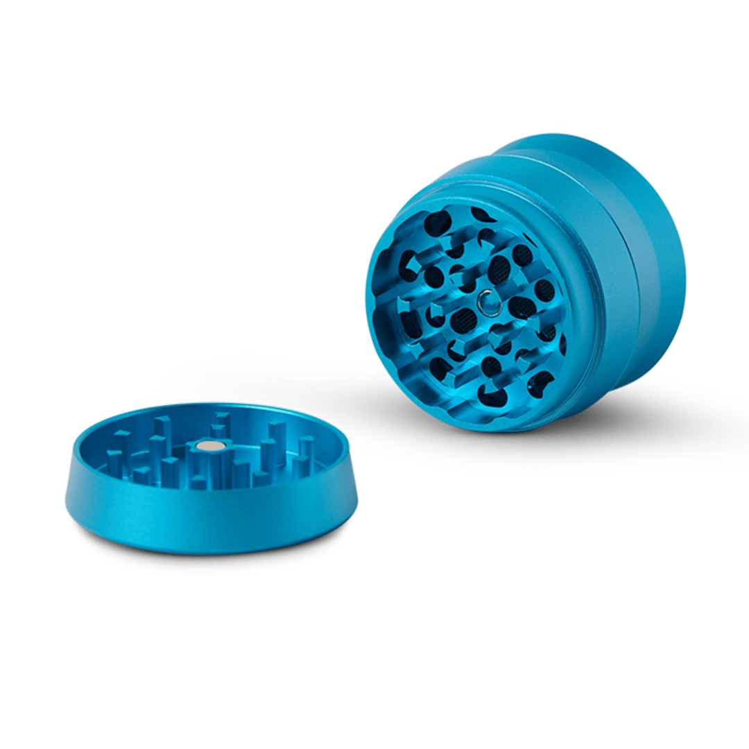 Close-up angled view of the Human Grade Grinder 3A (2" 4-Piece) with visible grinding teeth, isolated on a white background.