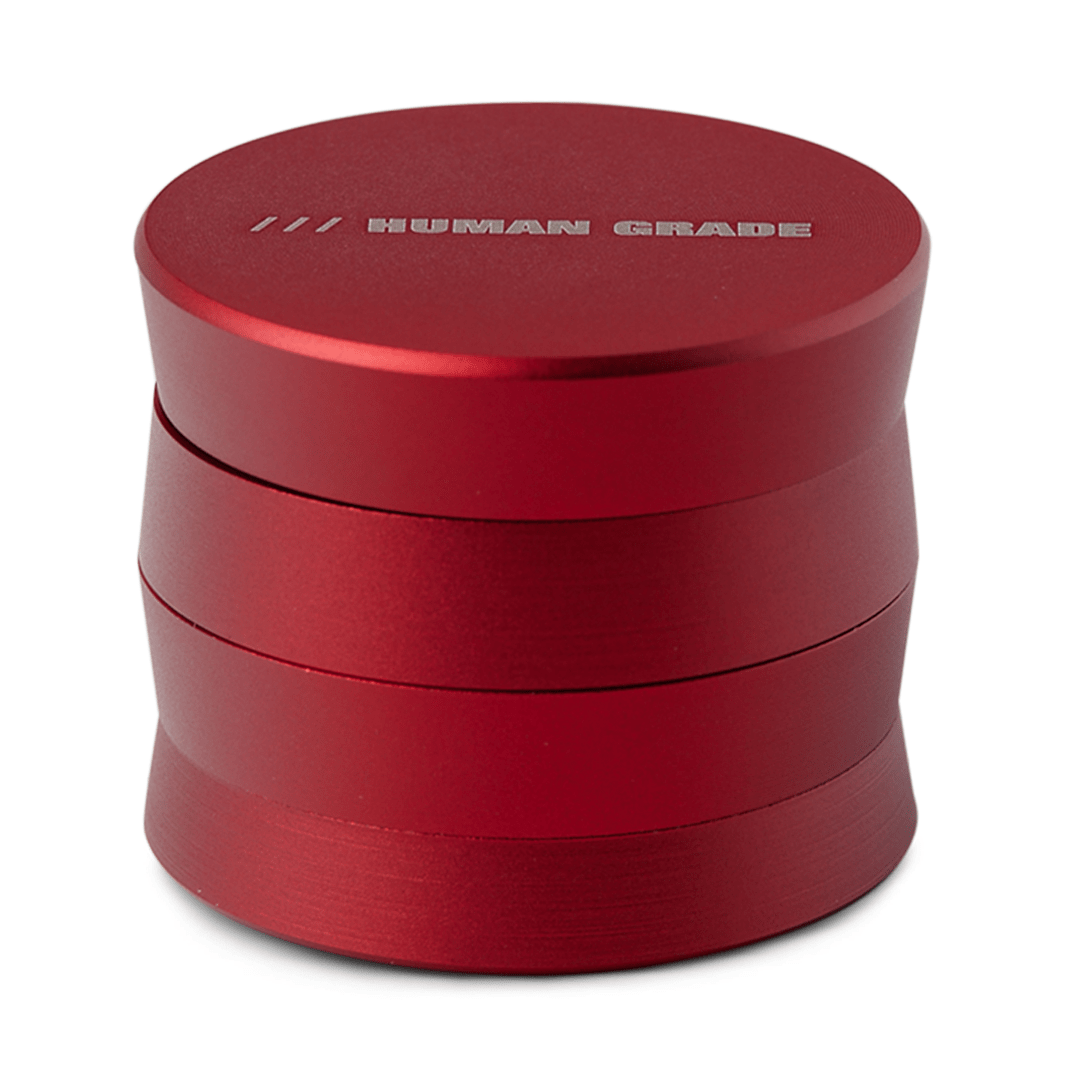 Front view of the Human Grade Grinder 3A (2” 4-Piece) with a sleek, metallic design and a cylindrical shape.