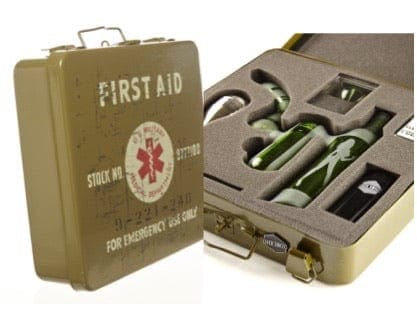 The First Aid Smoking Kit is displayed open, revealing its contents inside a metallic, olive-green case with a red cross emblem.