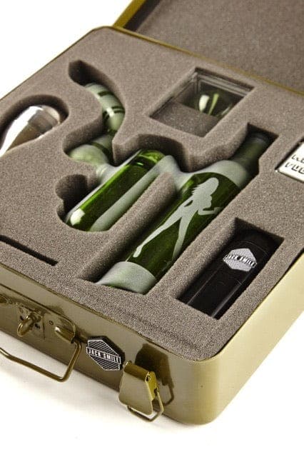 Top-down view of the First Aid Smoking Kit nestled in a molded foam insert inside an open, tan-colored case.