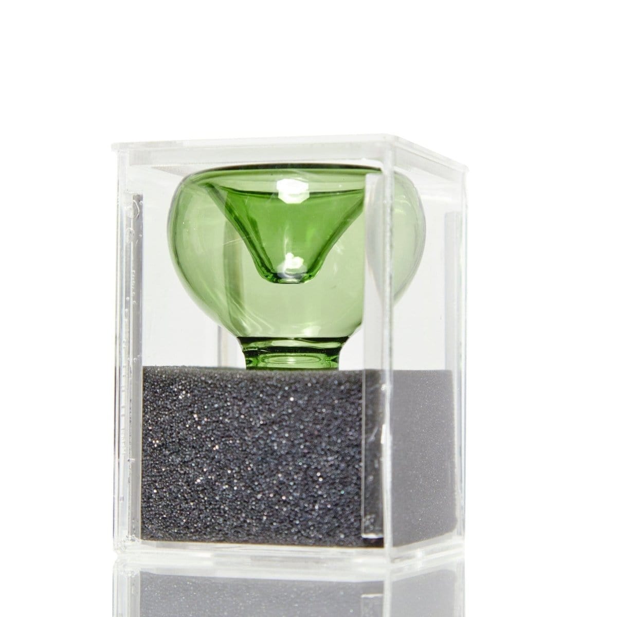 Front view of the First Aid Smoking Kit, encased in a clear acrylic box on a black surface.