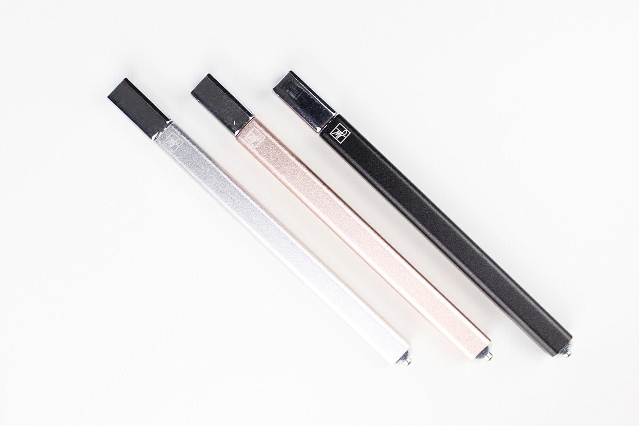 The Trio displayed as a studio shot of three clear glass tubes arranged in a diagonal line.