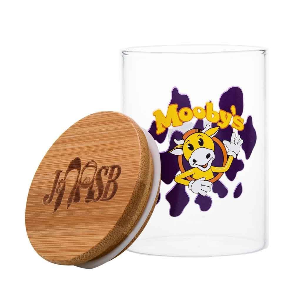 Front view of the Mooby's Stash Jar, a clear glass jar with a cartoon character design on a white background.