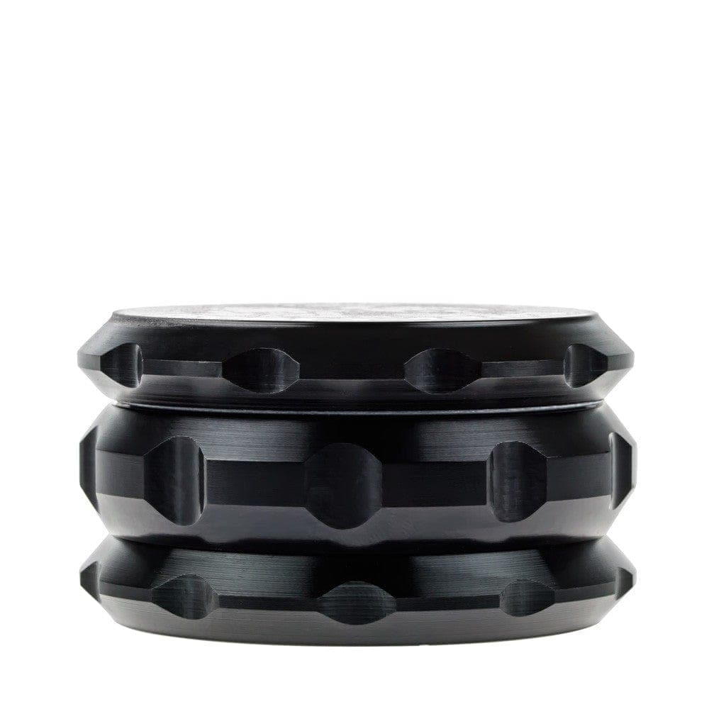 A close-up, angled view of the Buddy Christ Grinder, showcasing its cylindrical shape and textured design against a plain background.