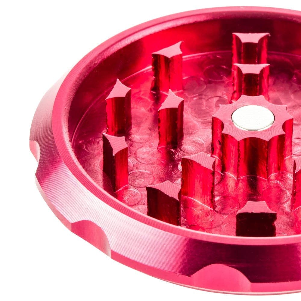 A close-up, top-down view of the Jay and Silent Bob's Secret Stash Grinder, revealing the metallic grinding teeth inside.