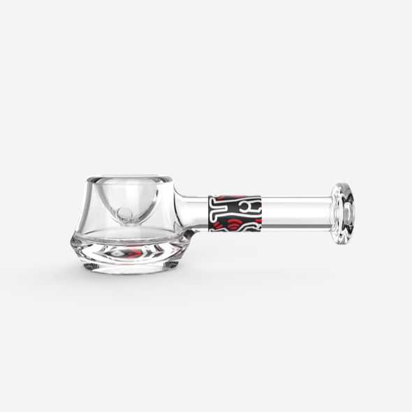 A side view of the K.Haring Spoon Pipe, showing its curved bowl and smooth glass construction against a plain white background.