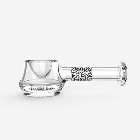 Front view of the K.Haring Spoon Pipe, a clear glass pipe with a simple, curved design.