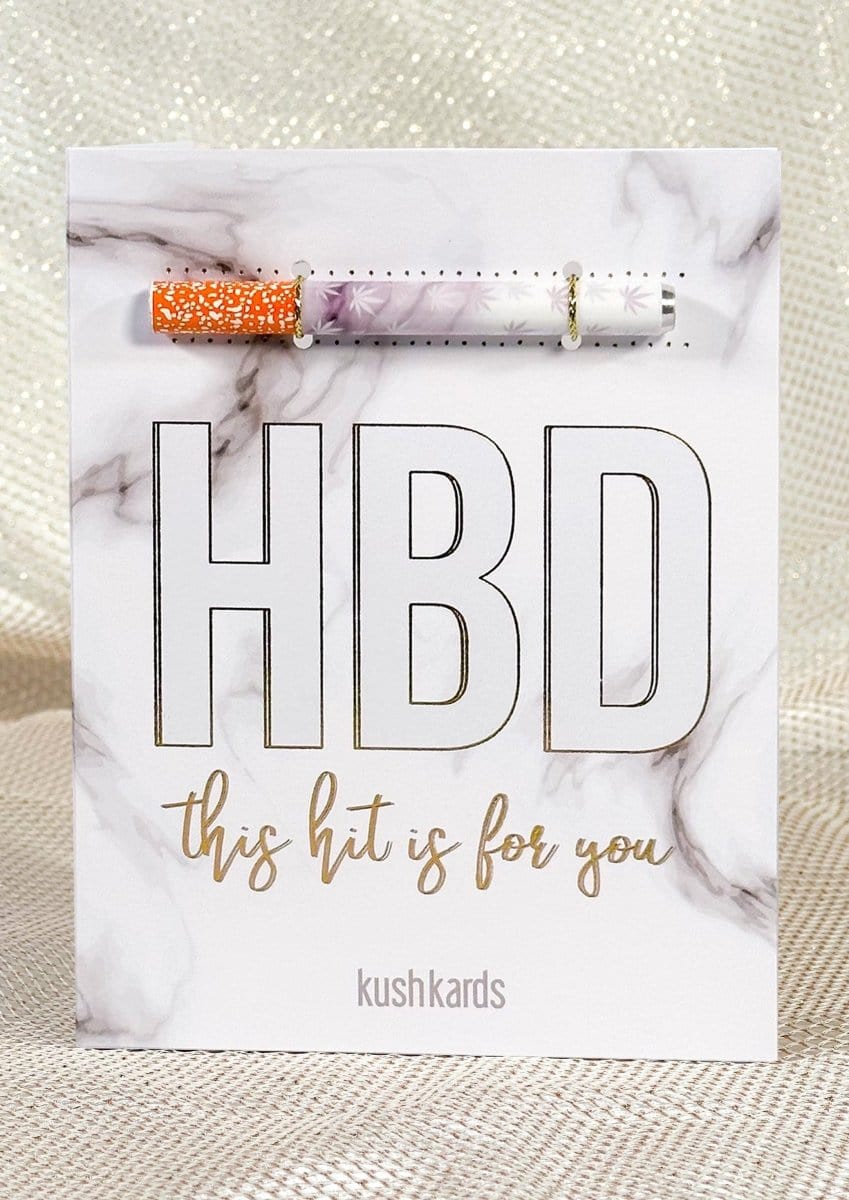 Front-facing shot of a marble-patterned card with a pre-rolled joint attached above bold "HBD" lettering, titled "🍰 HBD Birthday Cannabis Greeting Card"