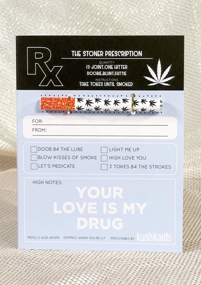 Front-facing view of the 🖤 Stoner Prescription Cannabis Greeting Card showing a white one-hitter with black leaf pattern clipped to the card's blue prescription layout.