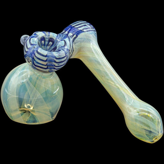 A three-quarter view of the “Raked Sidecar” Fumed Sidecar Bubbler Pipe, showcasing its colorful glass swirls and curved design.