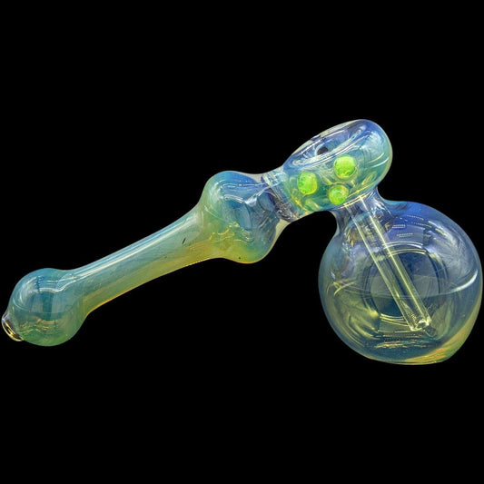 A side view of the “Silver Hammer” Fumed Hammer Bubbler Pipe, showing its colorful glass and curved design against a dark background.