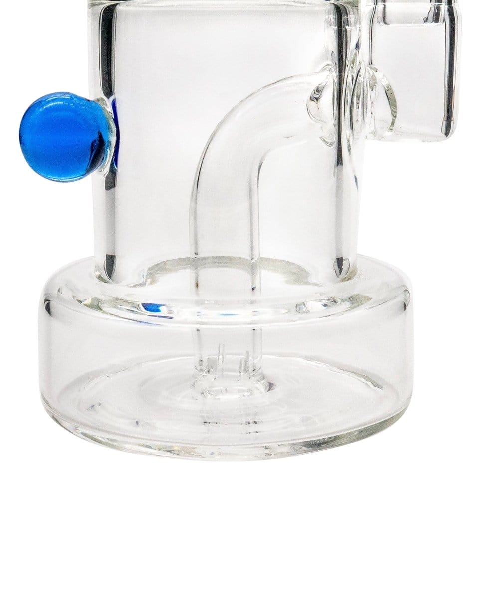 A close-up, angled view of the Layer Cake Color Accented Dab Rig, showcasing its clear glass construction and colorful accent.