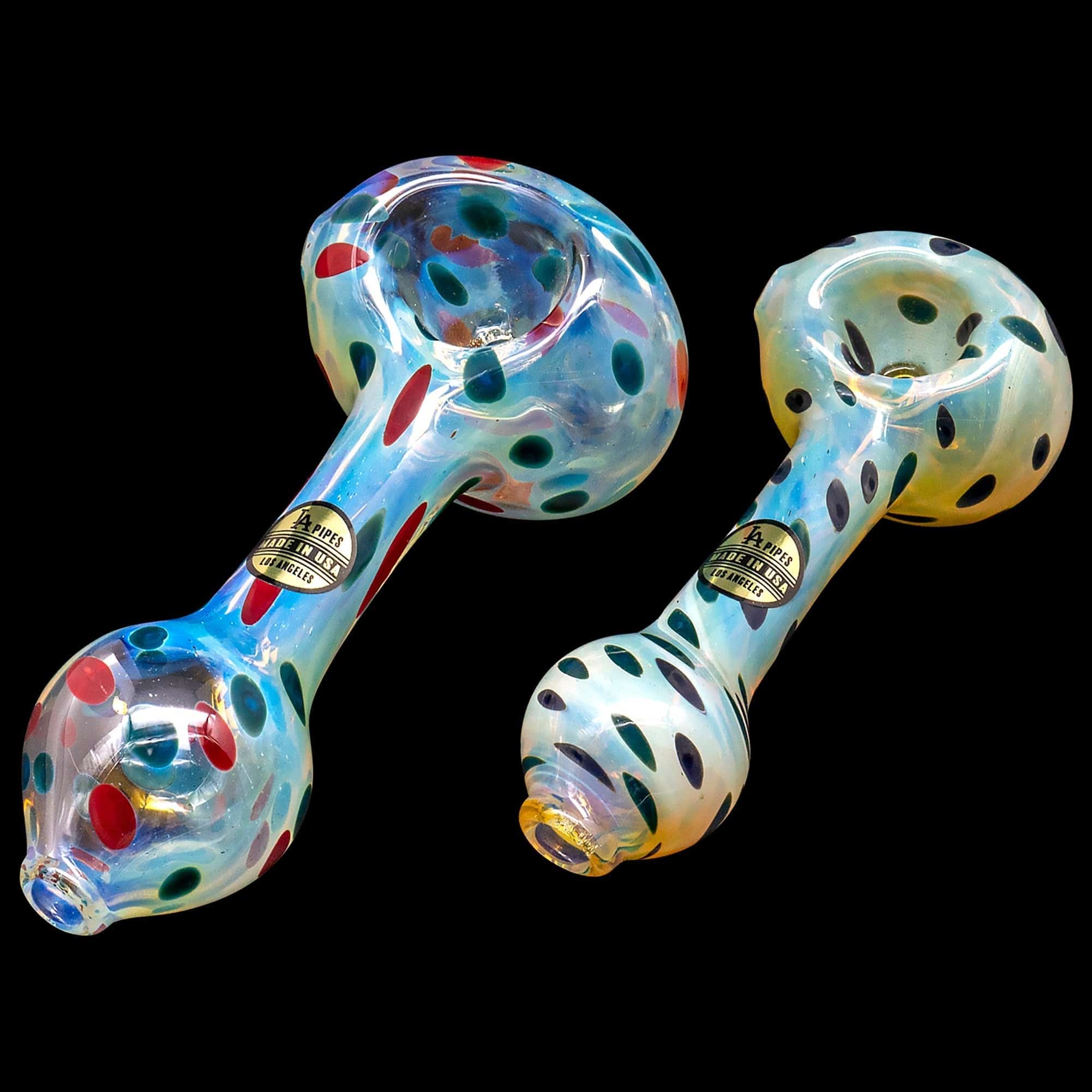 A studio shot displays the “Polka Dot” Glass Spoon Pipe, showcasing its colorful, patterned glass design against a black background.