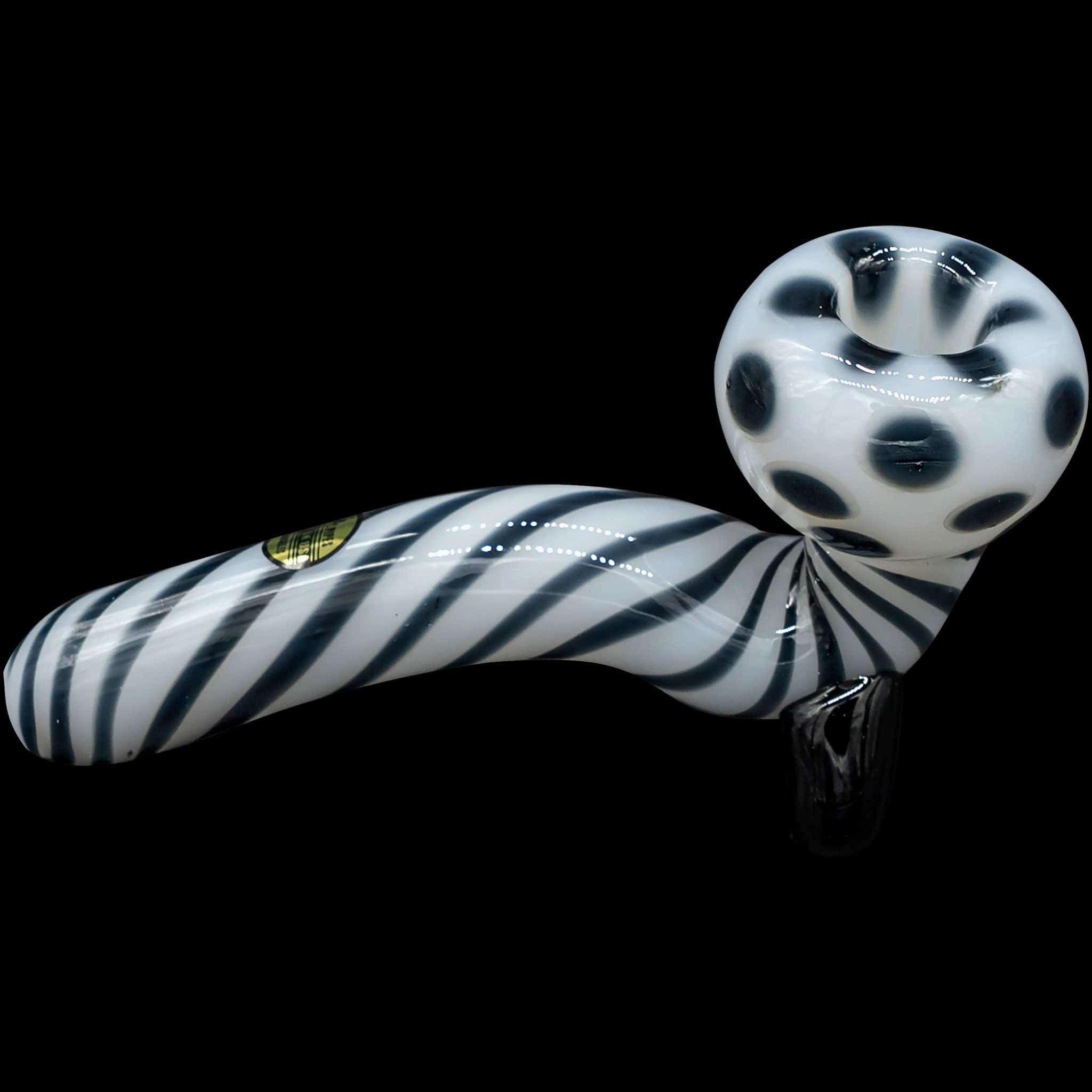 A side view of the “Ivory Locks” Bone White Sitting Sherlock Glass Pipe, showing its curved form and detailed glasswork.