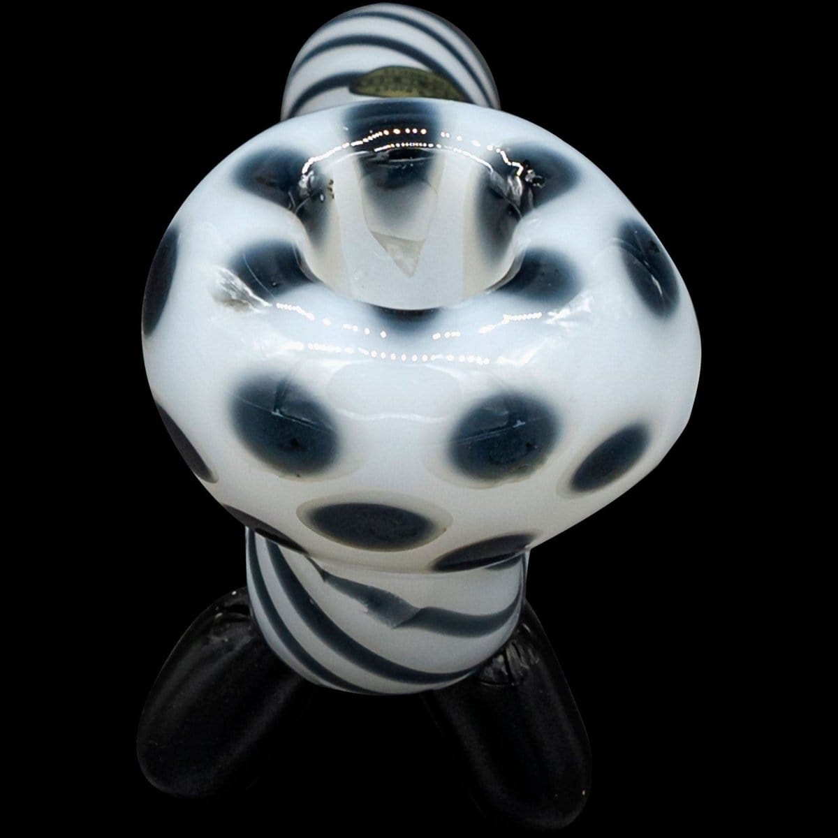 Front view of the “Ivory Locks” Bone White Sitting Sherlock Glass Pipe, featuring a decorative, spotted pattern against a dark background.