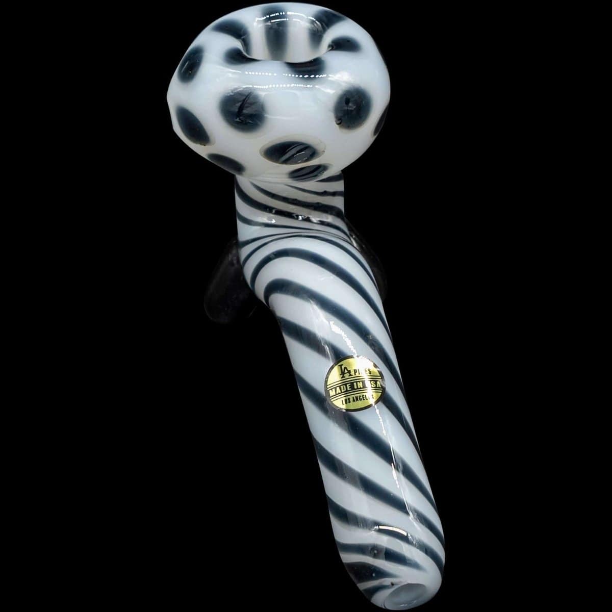 A studio shot of the “Ivory Locks” Bone White Sitting Sherlock Glass Pipe, showcasing its curved form against a dark backdrop.