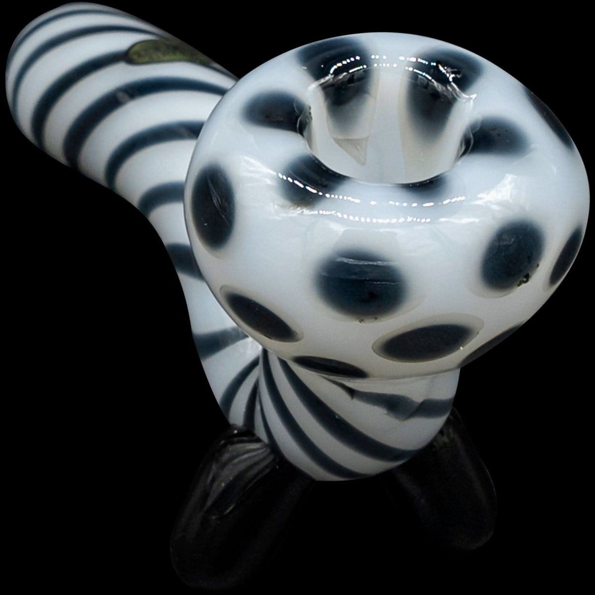 Front view of the “Ivory Locks” Bone White Sitting Sherlock Glass Pipe, displaying a white, curved design against a dark backdrop.