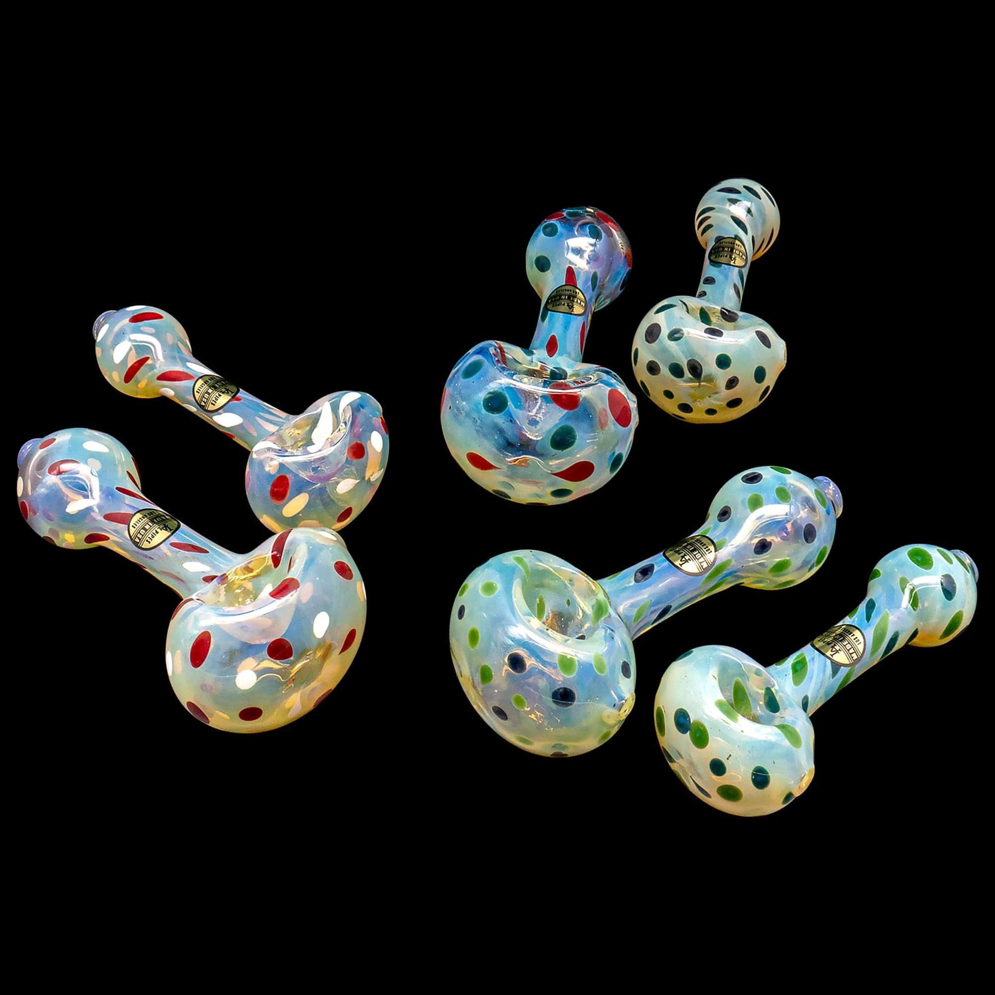 A front view of the “Polka Dot” Glass Spoon Pipe, showcasing its colorful, speckled design against a dark background.