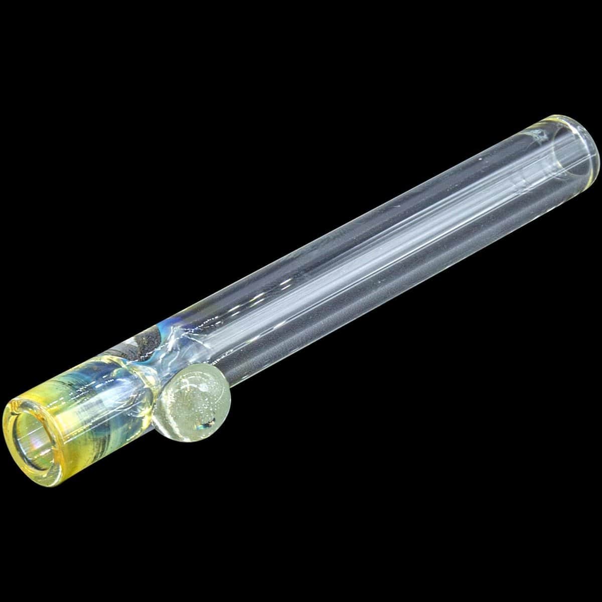 A close-up, angled view of the “One Hitter Never Quitter” glass one-hitter, showcasing its clear glass construction.