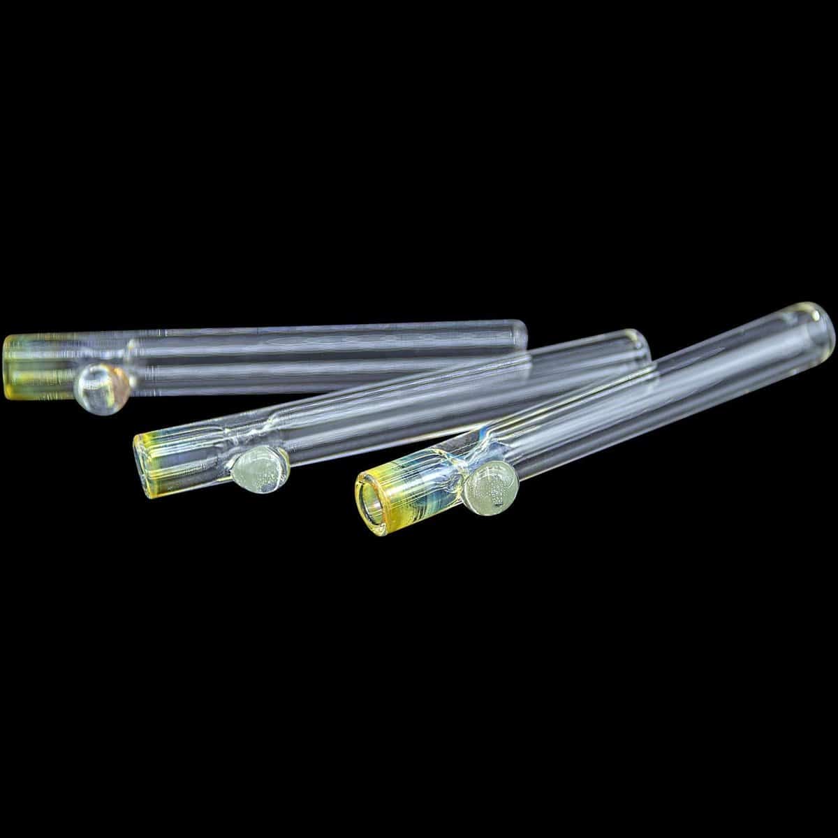 A slightly angled view of the “One Hitter Never Quitter” Glass One-Hitter, showing its simple, cylindrical glass form.