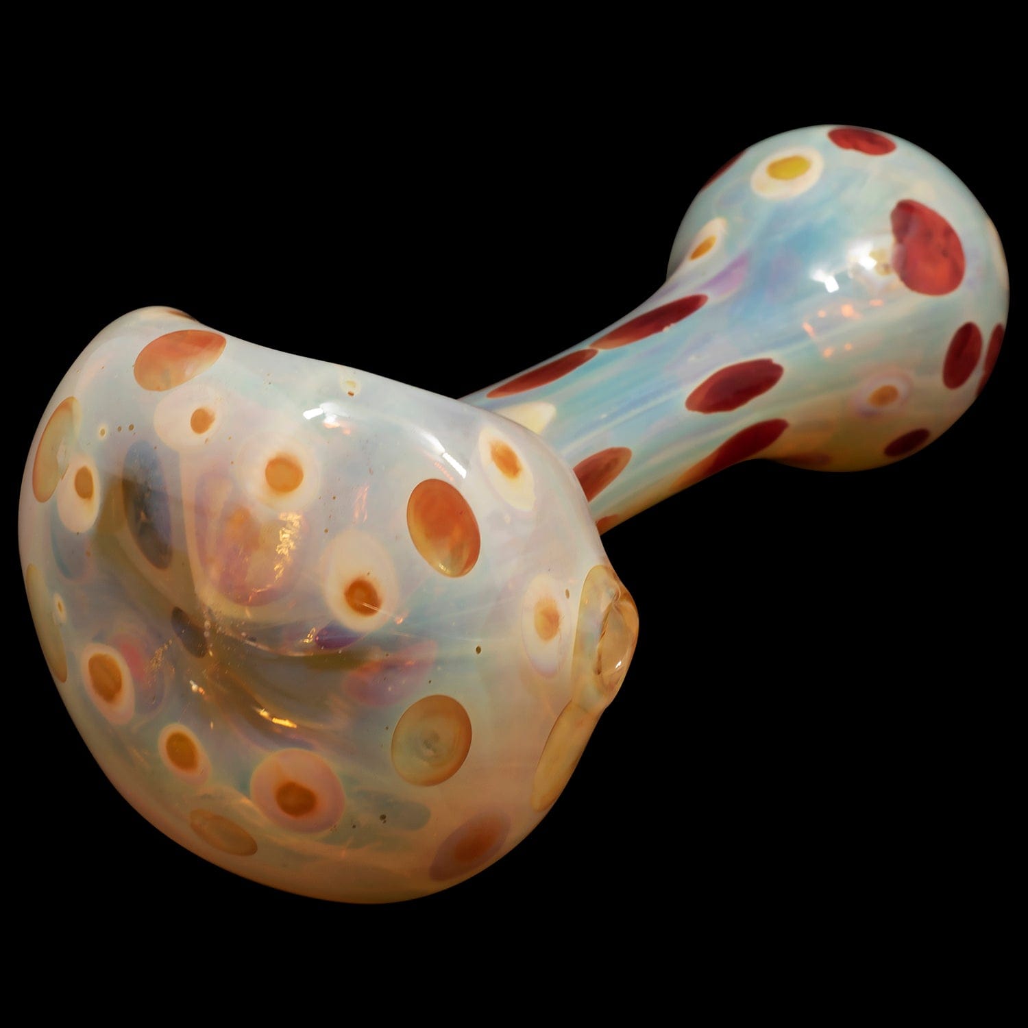 A slightly angled view of the “Polka Dot” Glass Spoon Pipe, showcasing its colorful speckled pattern against a dark backdrop.