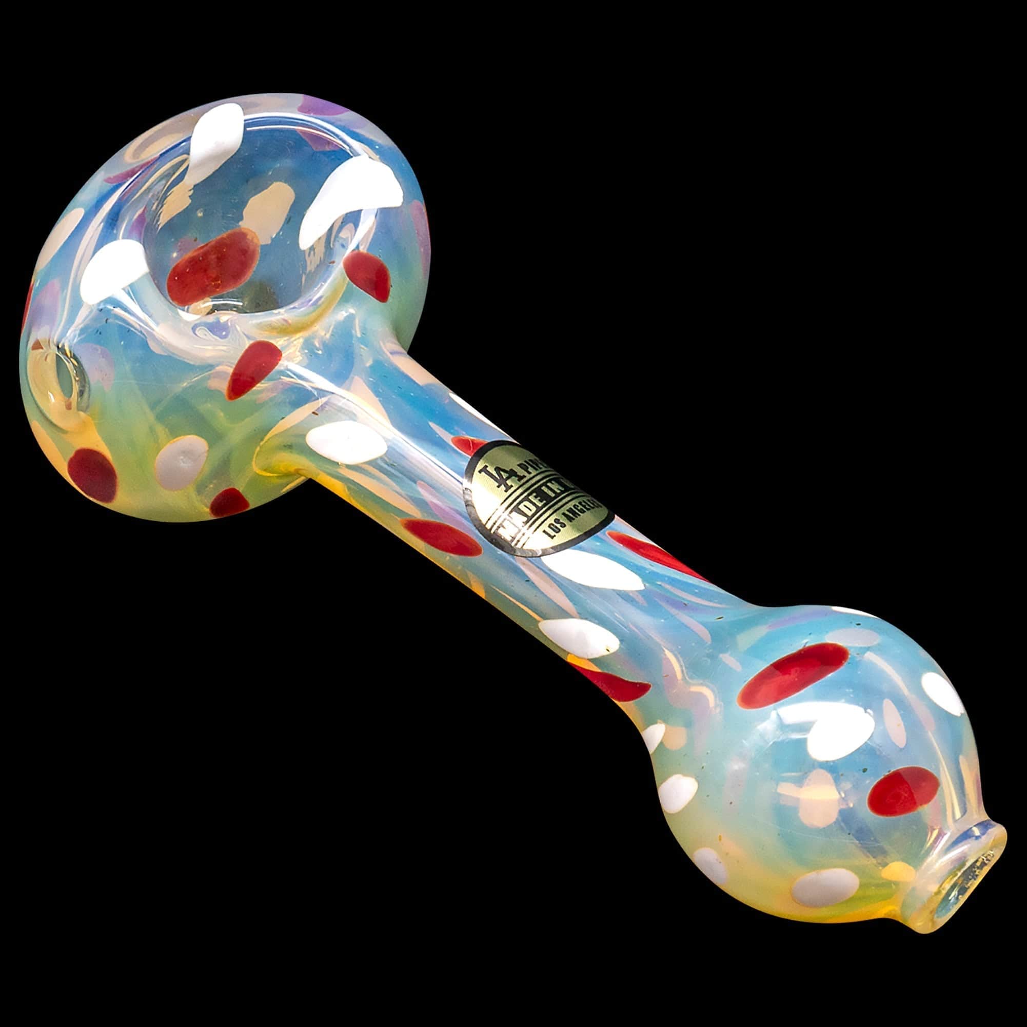 Front view of the “Polka Dot” Glass Spoon Pipe, displaying a colorful, speckled glass design in a curved, handheld shape.