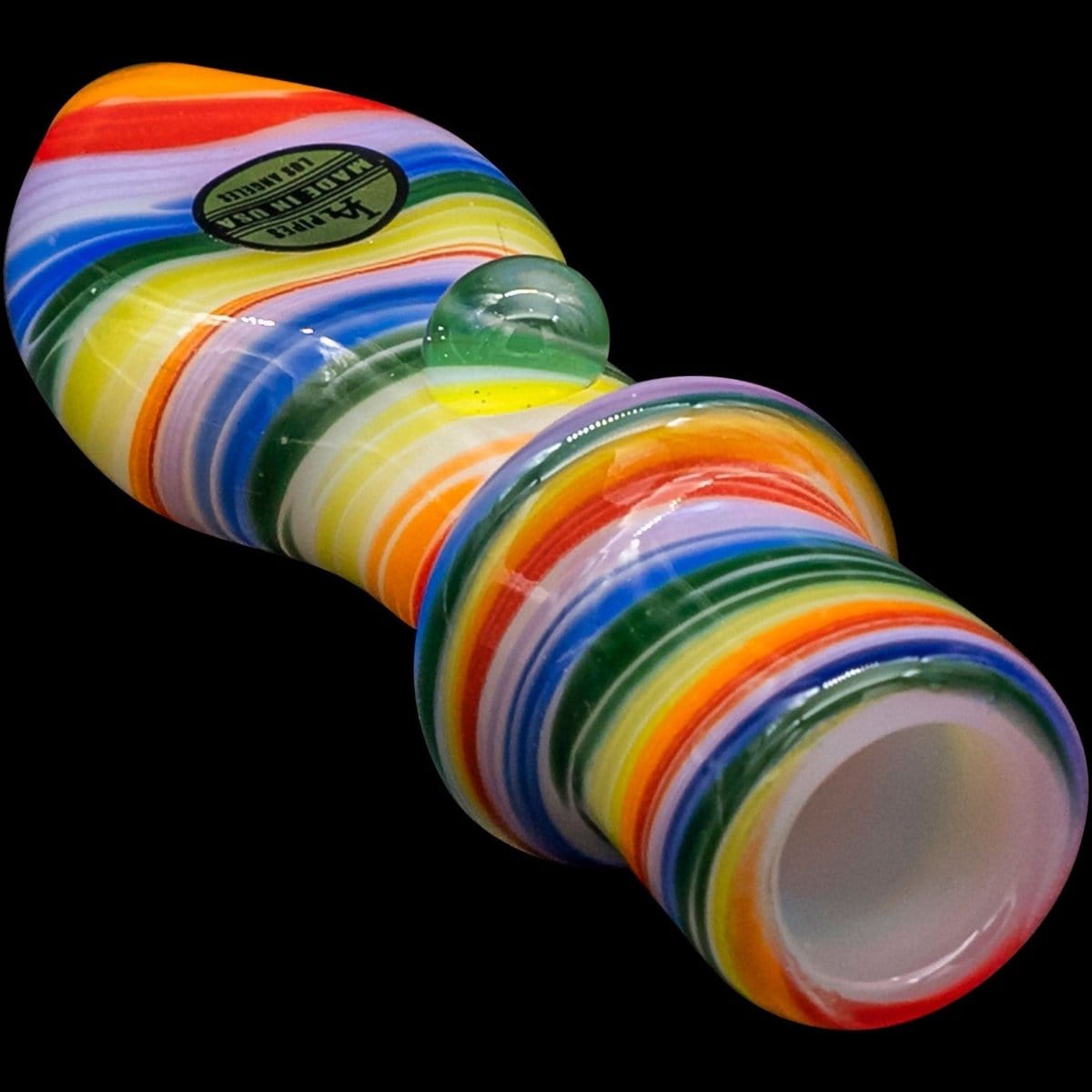 A close-up, angled view of the “Rainbow Tornado” Chillum Pipe, showcasing its vibrant, swirling multicolored glass design.